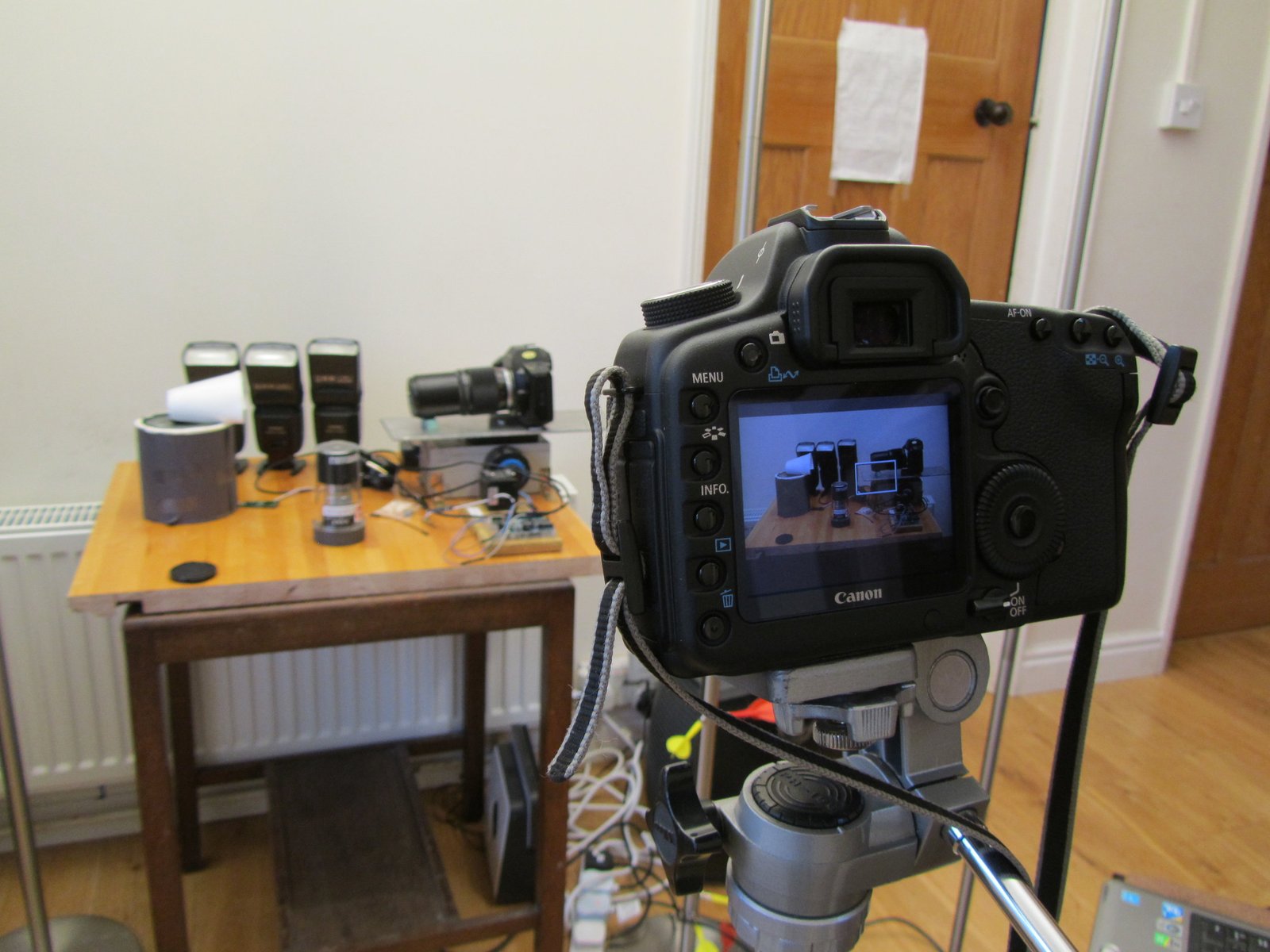 The DSLR filming the focus stacking setup, with decoy camera body in place